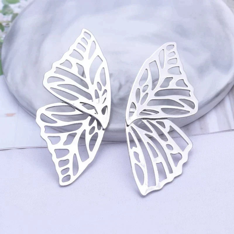 Boucles d'oreilles papillon en or et argent