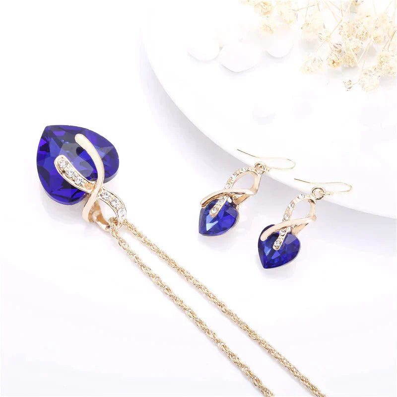 Ensemble collier et boucles d'oreilles « Amour » avec zircon bleu en or