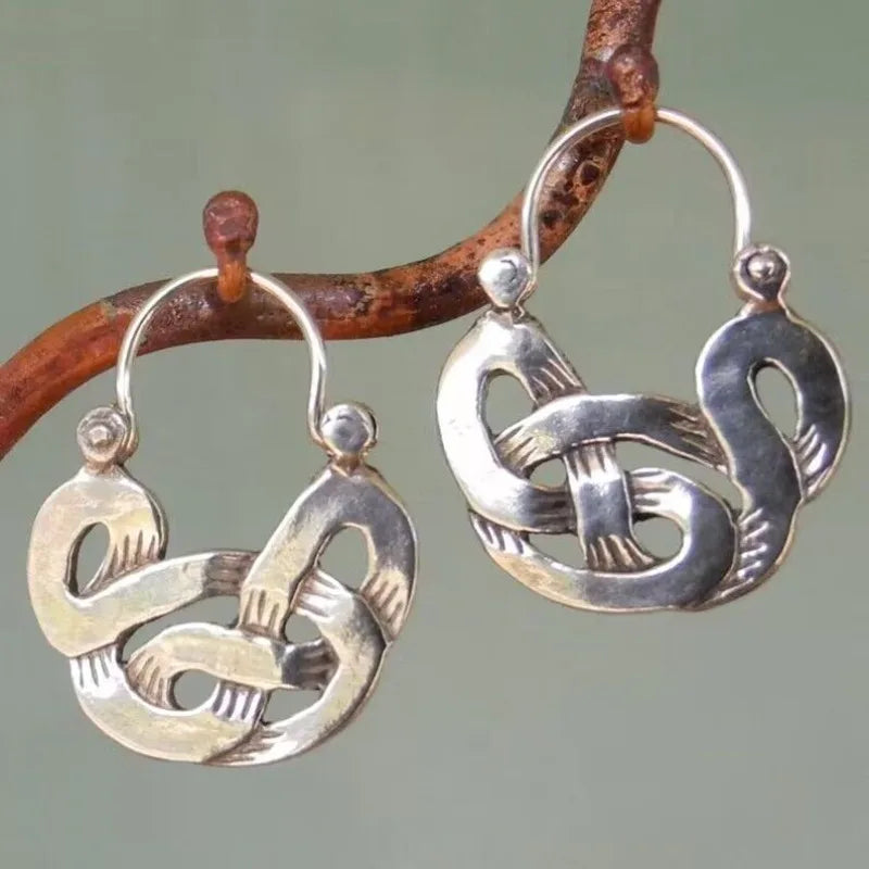 Boucles d'oreilles créoles vintage en argent avec nœud