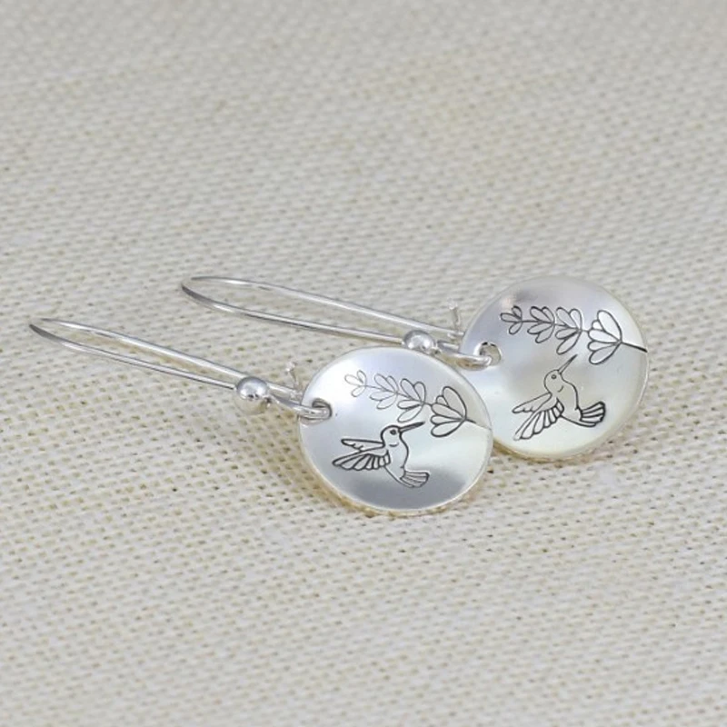 Boucles d'oreilles vintage en argent avec motif oiseau