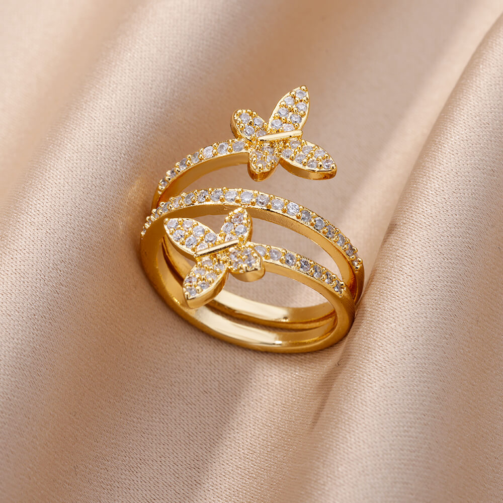 Anillo de mariposas con circonitas doradas
