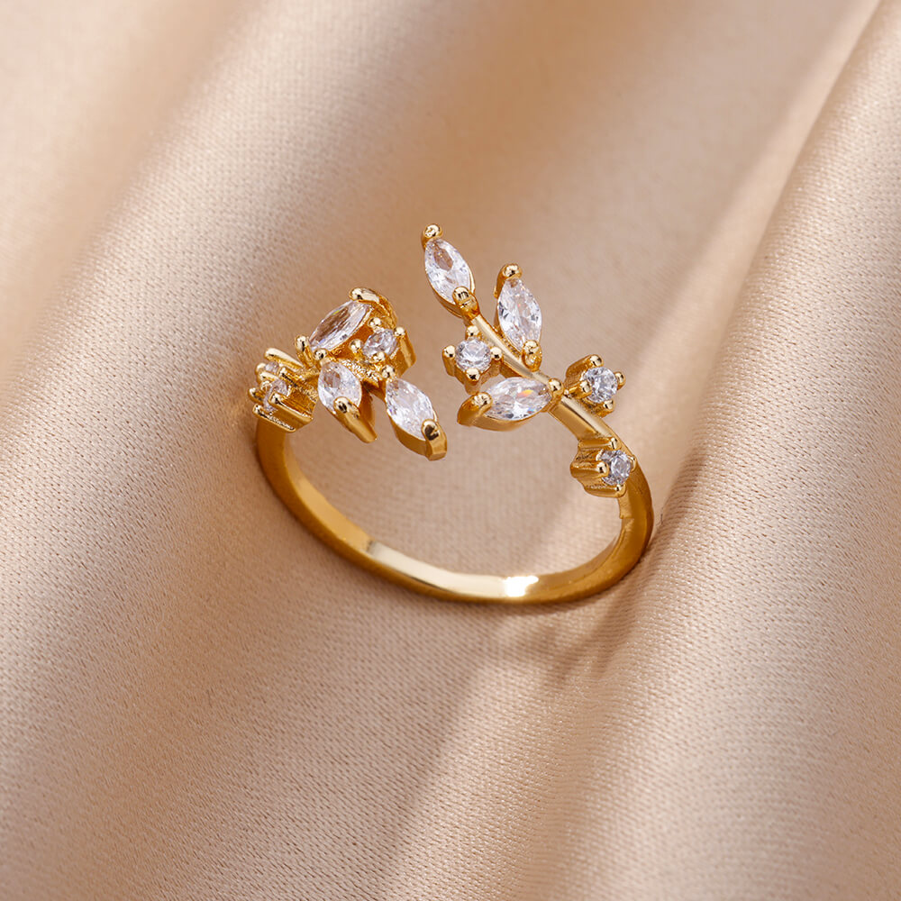 Anillo de hoja de circonita dorada
