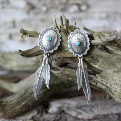 Pendientes vintage de plumas turquesas