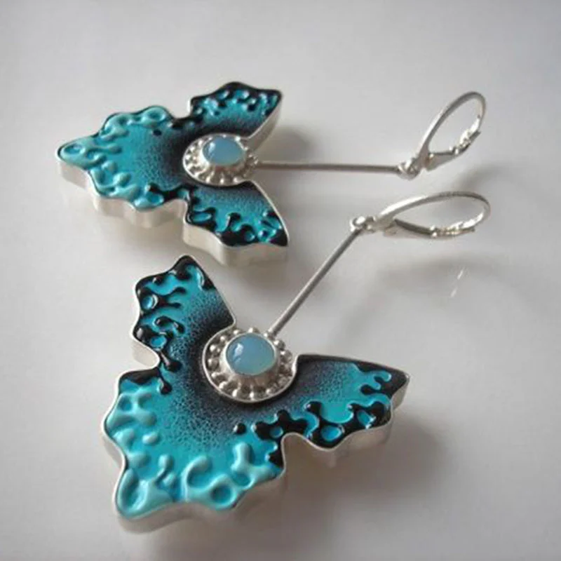Boucles d'oreilles papillon vintage en émail bleu