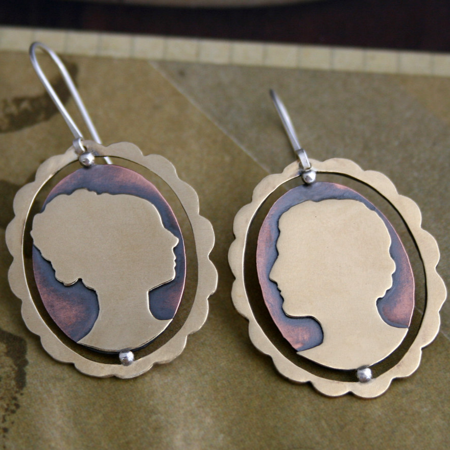 Pendientes vintage de plata con cara redondeada