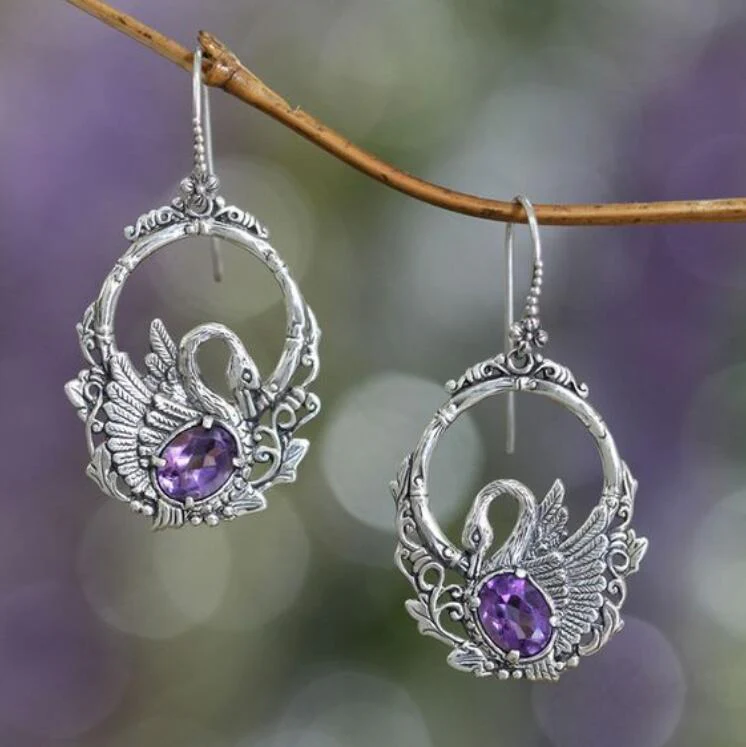 Pendientes vintage de cisne de plata con cristal morado