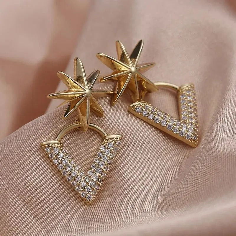 Pendientes vintage dorados con estrella y forma de V