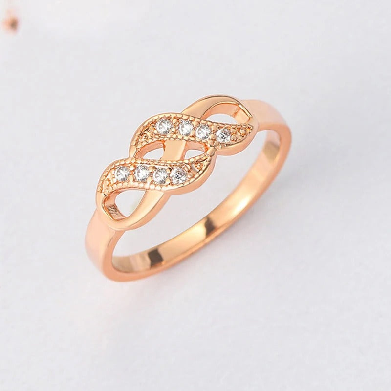 Bague vintage en or rose torsadé avec nœud infini