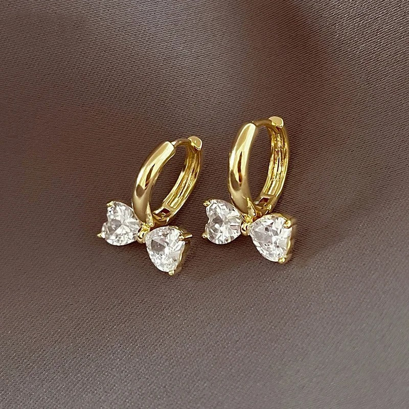 Pendientes de aro vintage con lazo floral dorado