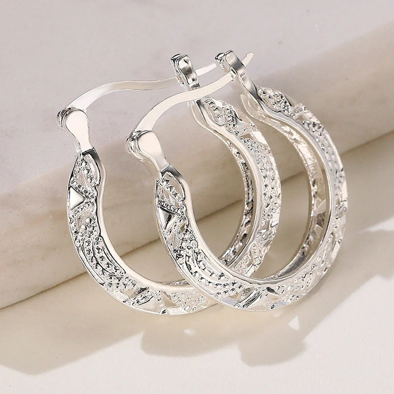 Boucles d'oreilles vintage en argent sculpté