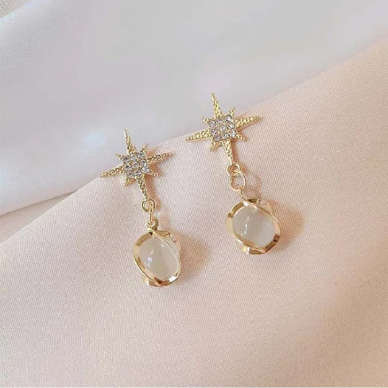 Pendientes colgantes de estrella y piedra dorada