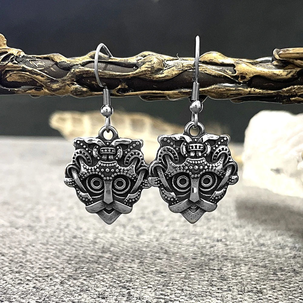 Boucles d'oreilles vintage en argent représentant un masque tribal