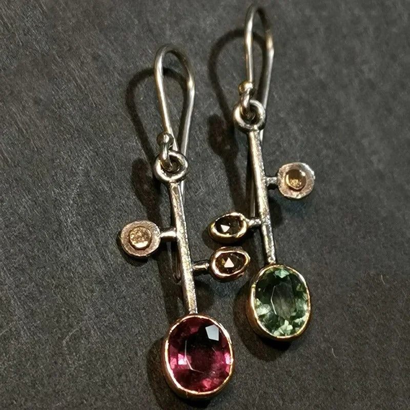 Pendientes vintage únicos con detalles en plata y oro
