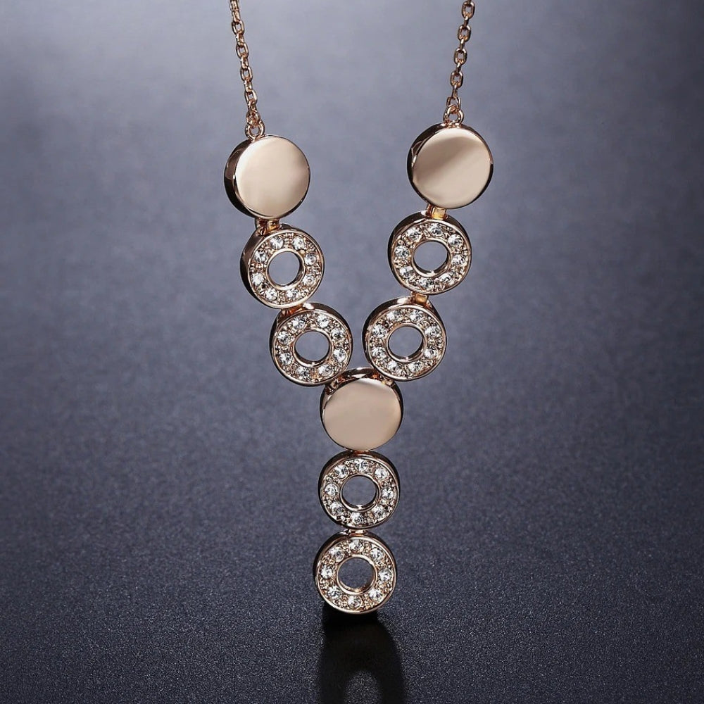 Collier vintage en or rose et cristal rond