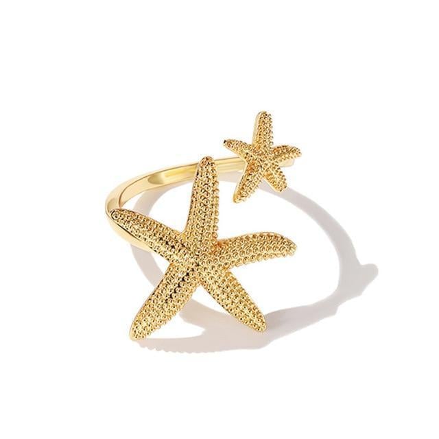 Anillo de estrella de mar ajustable en plata y oro