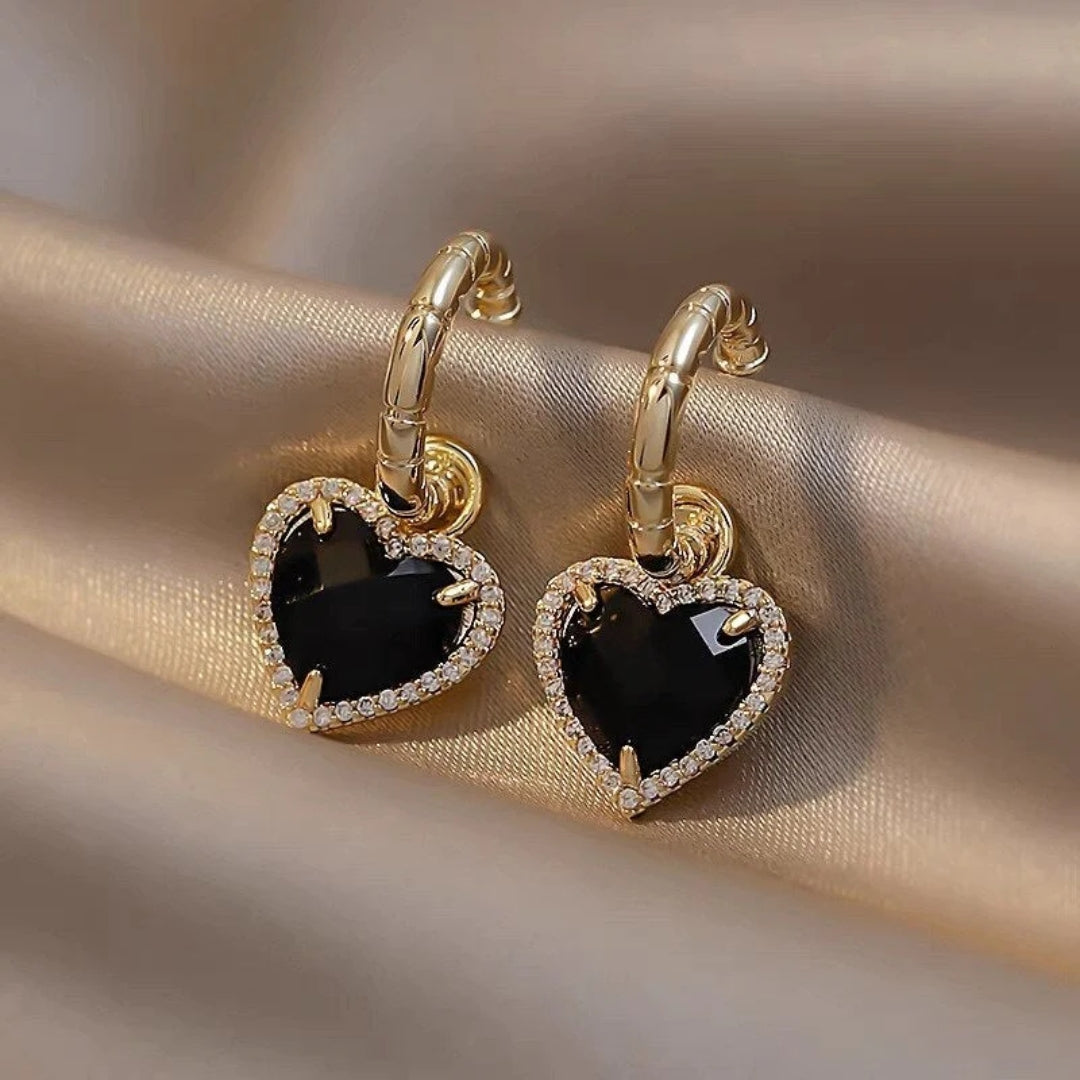Pendientes de corazón negro dorado 