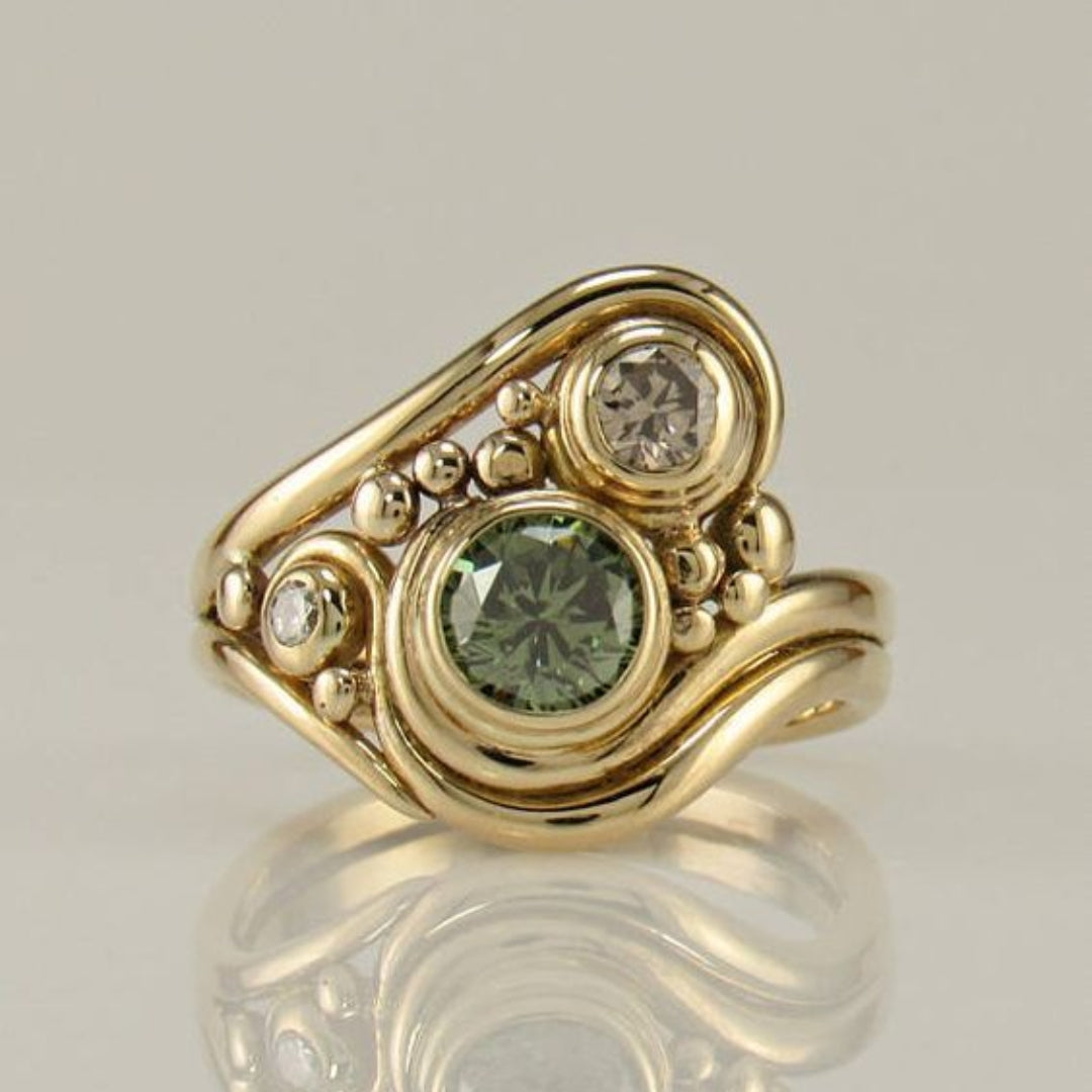 Anillo vintage de circonita verde dorada 