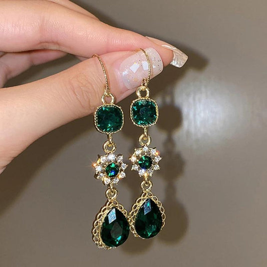 Boucles d'oreilles pendantes en or avec zircon vert 