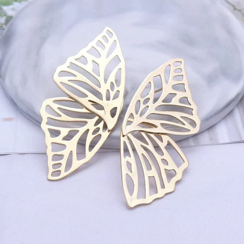 Boucles d'oreilles papillon en or et argent