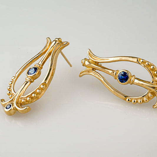 Pendientes vintage de oro con diseño de nautilus azul