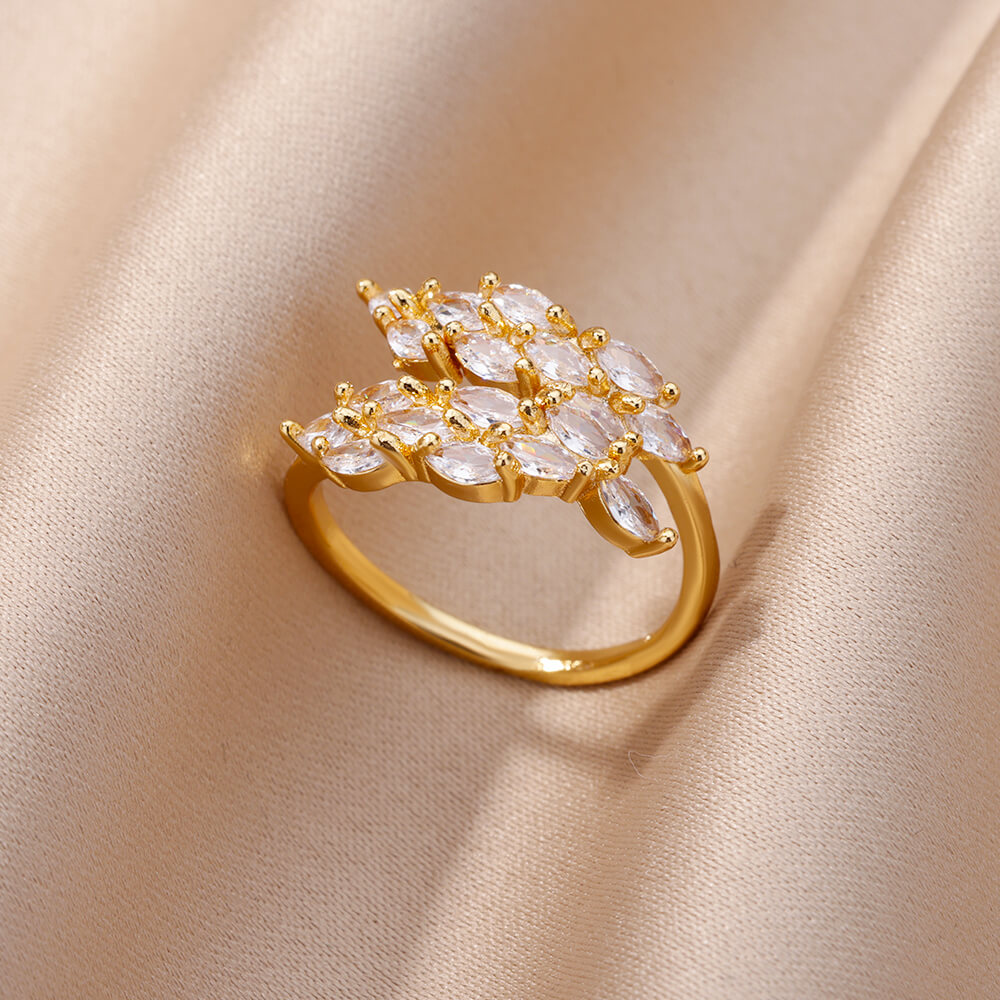 Anillo de doble hoja con circonitas doradas