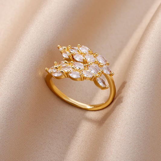Anillo de doble hoja con circonitas doradas