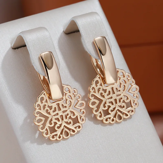 Elegantes pendientes dorados de mandala