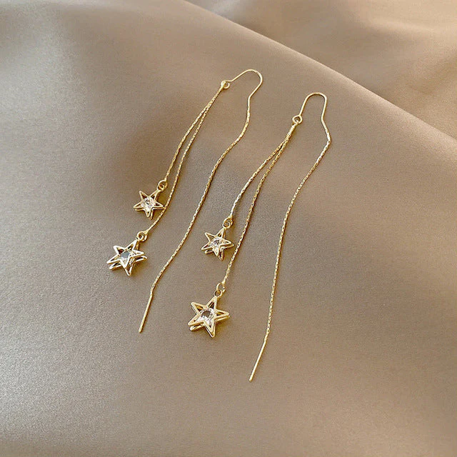 Pendientes de estrella de cristal dorado 