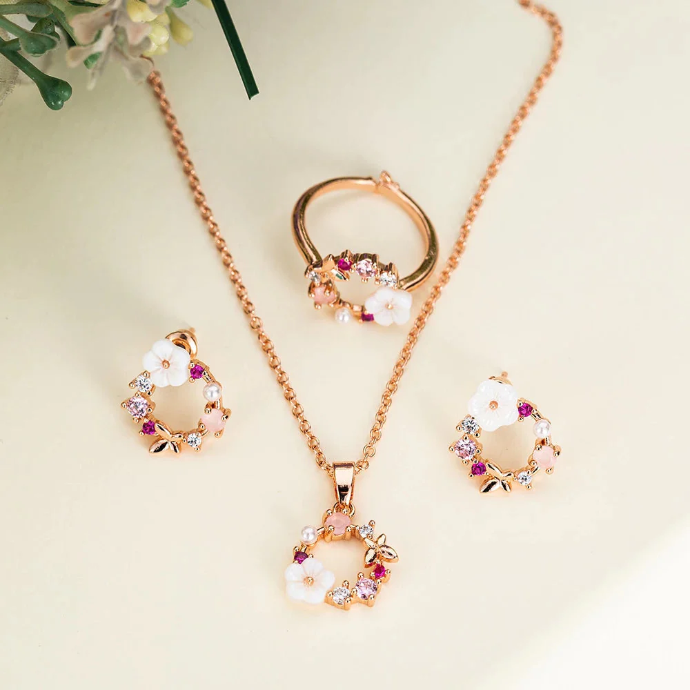 Conjunto de flores en oro rosa