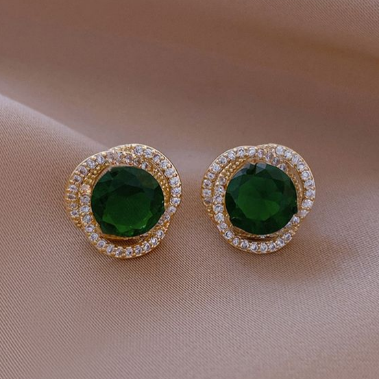 Elegantes pendientes de espiral de cristal verde brillante 