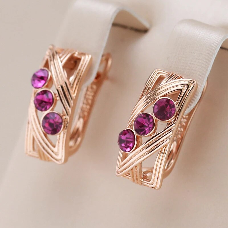 Elegantes pendientes de cristal morado con incrustaciones