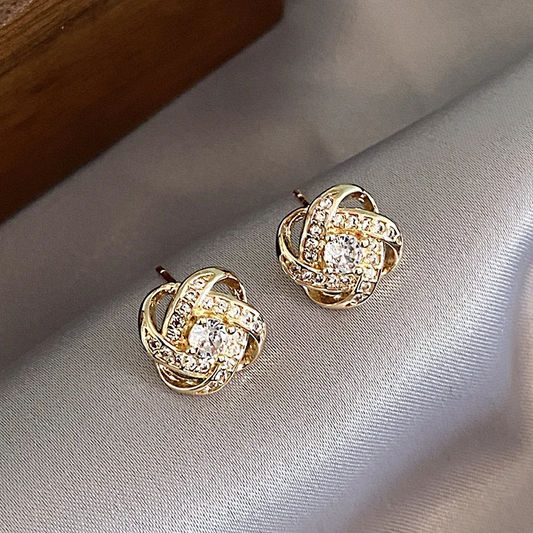 Boucles d'oreilles élégantes dorées brillantes à nœuds 