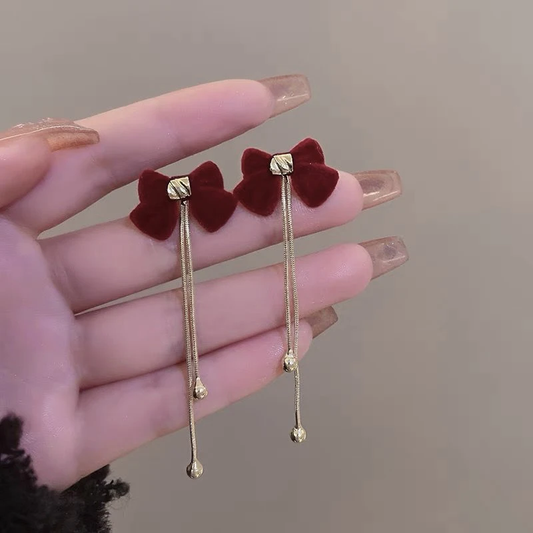 Boucles d'oreilles pendantes élégantes à nœud rouge 