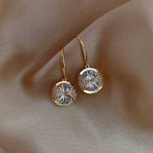 Pendientes colgantes redondos y brillantes de oro