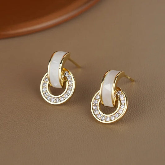 Pendientes de aro con cristales brillantes dorados y blancos