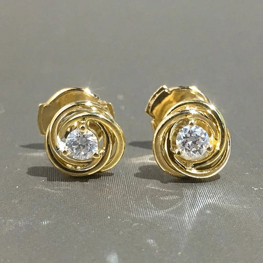Pendientes de espiral de oro brillante