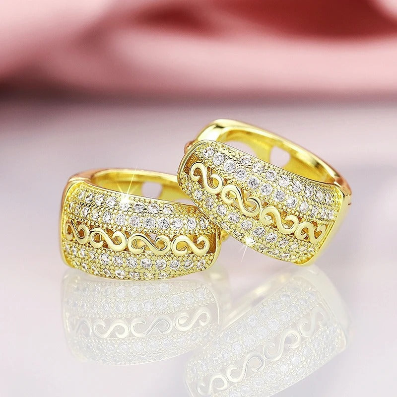 Pendientes dorados con diseño de ondas vintage