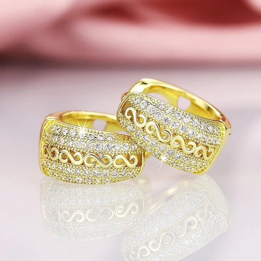 Pendientes dorados con diseño de ondas vintage