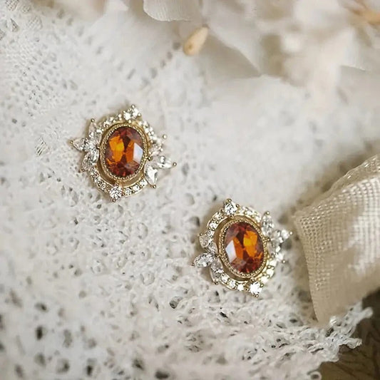 Pendientes marrones brillantes dorados
