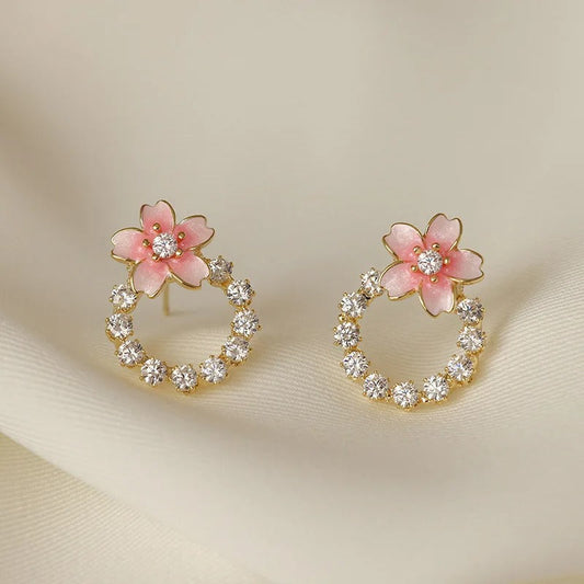Pendientes de botón con flores rosas y doradas