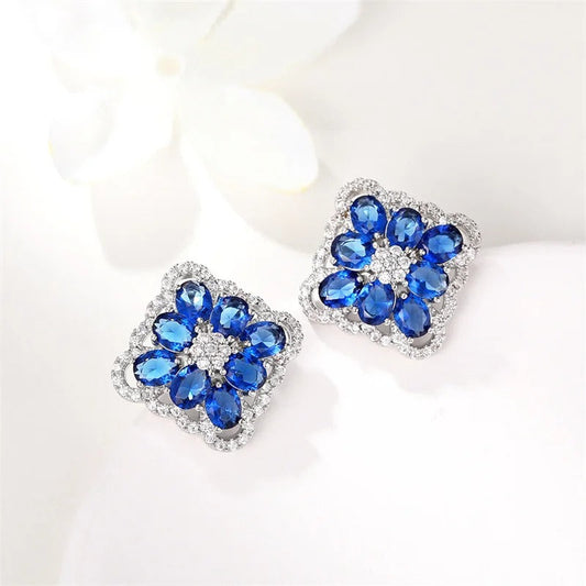 Pendientes de botón de cristal azul plateado