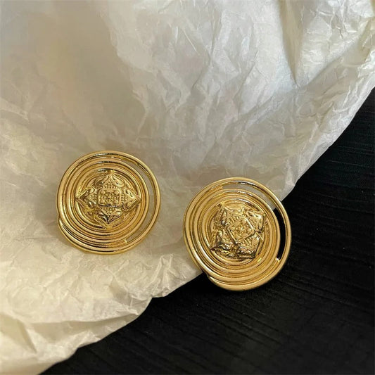 Pendientes vintage circulares en espiral de oro