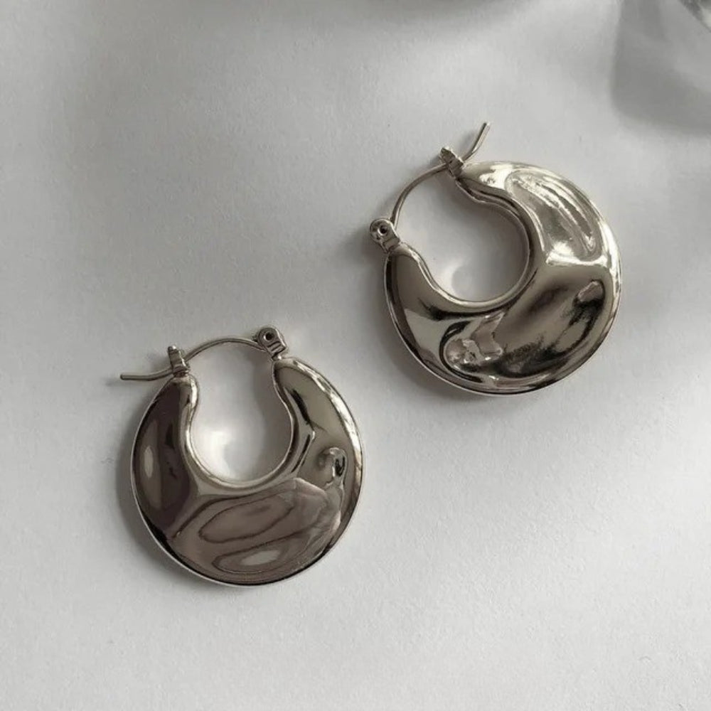 Pendientes de aro gruesos con forma de media luna brillante de plata