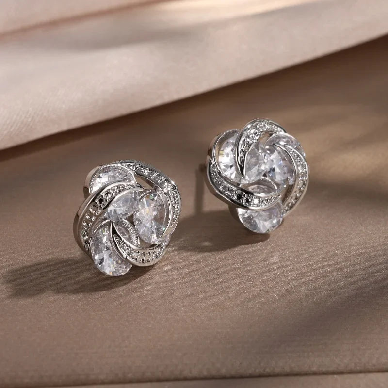 Pendientes de plata entrelazados con brillo