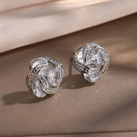 Pendientes de plata entrelazados con brillo